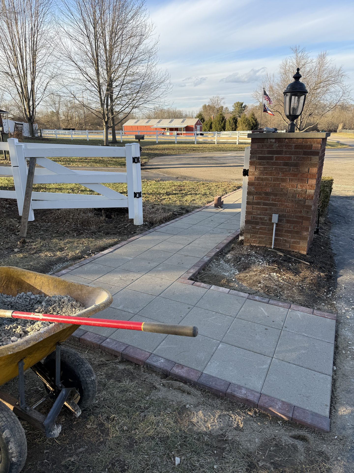 Finished paver walkway with brick pillar and lamp post